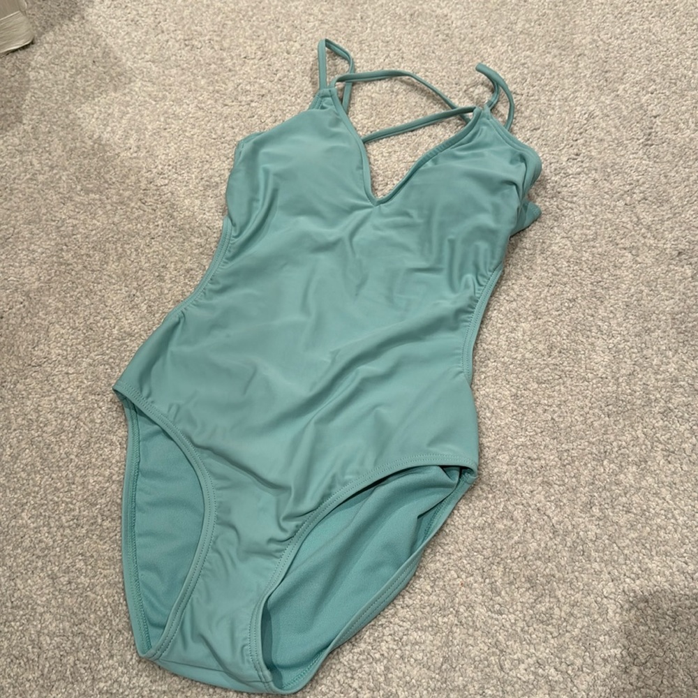 Cute one piece bathing suit in a light aqua blue
